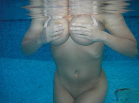Amateur model Sweet Krissy takes off her bikini while submerged in a pool