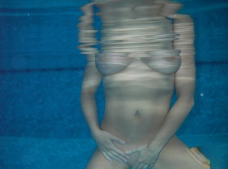 Amateur model Sweet Krissy takes off her bikini while submerged in a pool