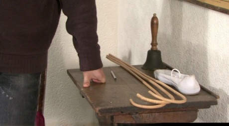 Brunette girl bends over for a spanking and extreme caning