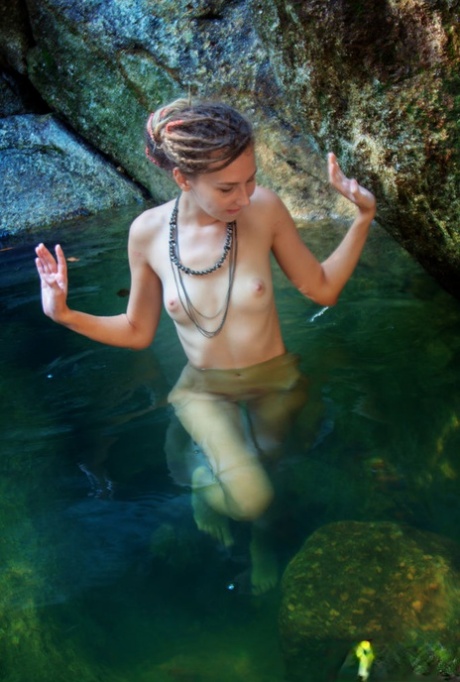 Nice teen Bullet relaxes in refreshing water while totally naked