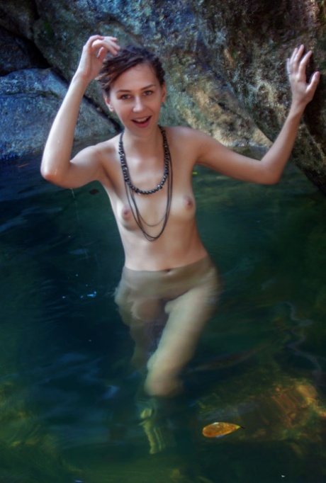 Nice teen Bullet relaxes in refreshing water while totally naked