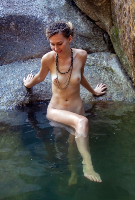 Nice teen Bullet relaxes in refreshing water while totally naked