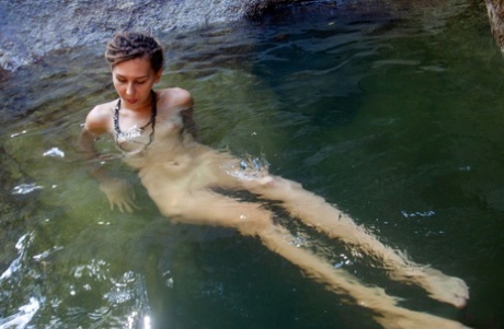 Nice teen Bullet relaxes in refreshing water while totally naked
