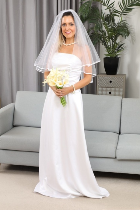 Miss V releases her tiny tits from her wedding dress during solo action