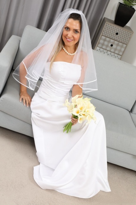 Miss V releases her tiny tits from her wedding dress during solo action