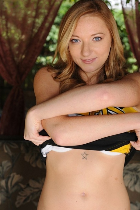 Kinky cheerleader Indiana Jane gets rid of her sexy uniform in public