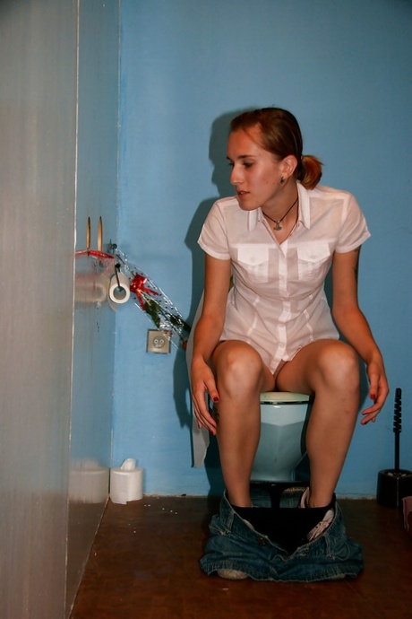 Lusty chick sucks and fucks a hard dick through a gloryhole