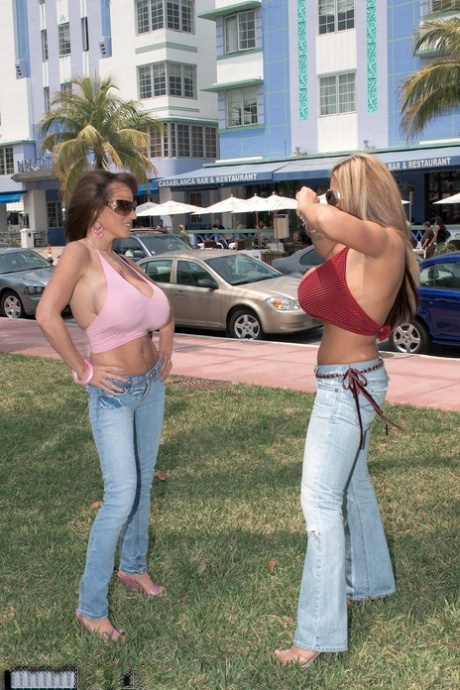 Busty Crystal and Cindy Cupps present their monster tits and play with a toy