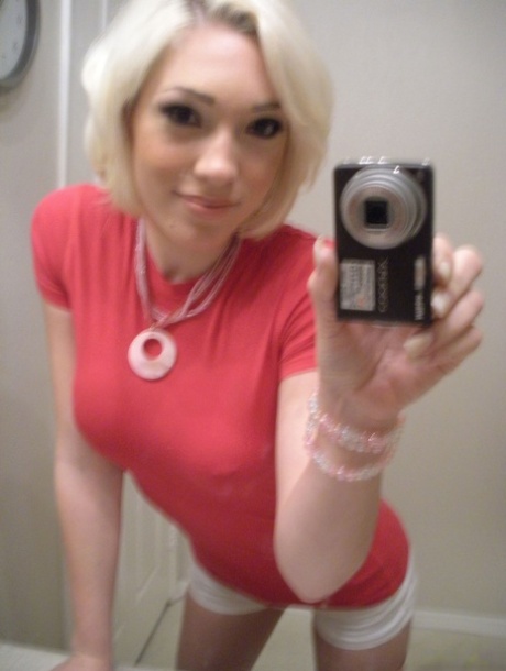 Gorgeous blonde American Lily Labeau takes selfies of her natural medium tits