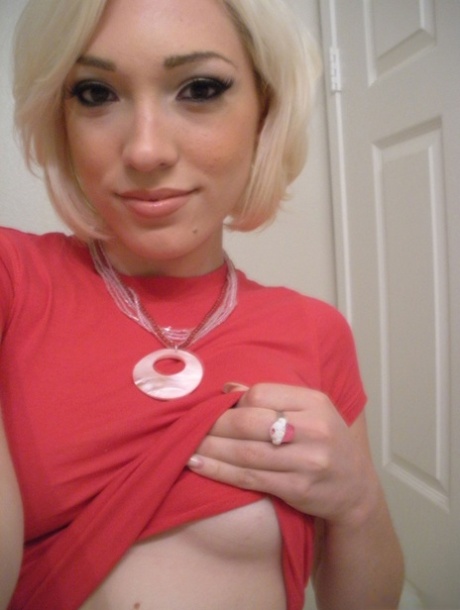 Gorgeous blonde American Lily Labeau takes selfies of her natural medium tits
