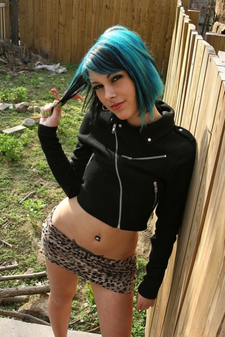 Beautiful petite party girl Azrael poses topless  fingers beaver in the yard