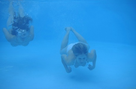Teens Iveta B & Yana B lose their bikinis and swim butt naked in the pool