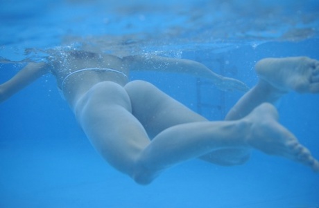 Teens Iveta B & Yana B lose their bikinis and swim butt naked in the pool