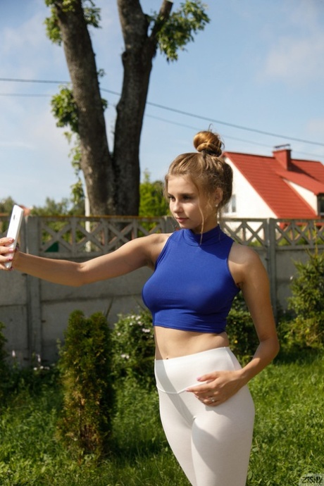Naughty amateur babe Ulyana Orsk squeezing her big natural tits & posing naked