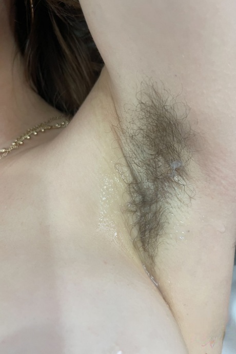 Amateur Fiona Sprouts shows her tits  hairy armpits  spreads her bald cunt