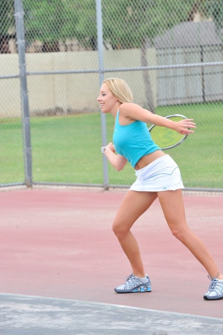 Lusty tennis player Shannon strips after practice and plays with her clit