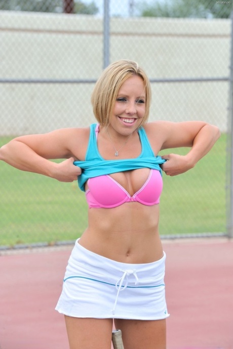 Lusty tennis player Shannon strips after practice and plays with her clit